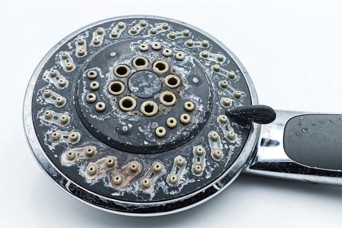 How to unclog a shower head by removing mineral deposits and debris