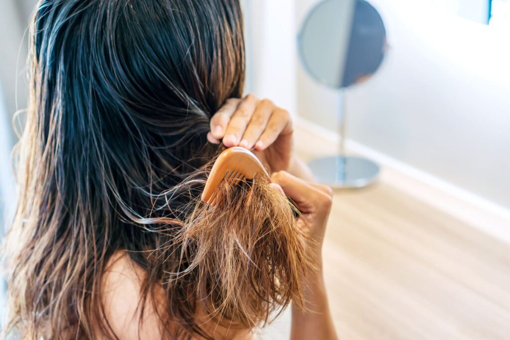 Hard water hair damage showing mineral buildup on dry brittle strands